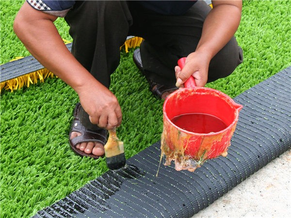 مادة لصق النجيل الصناعي